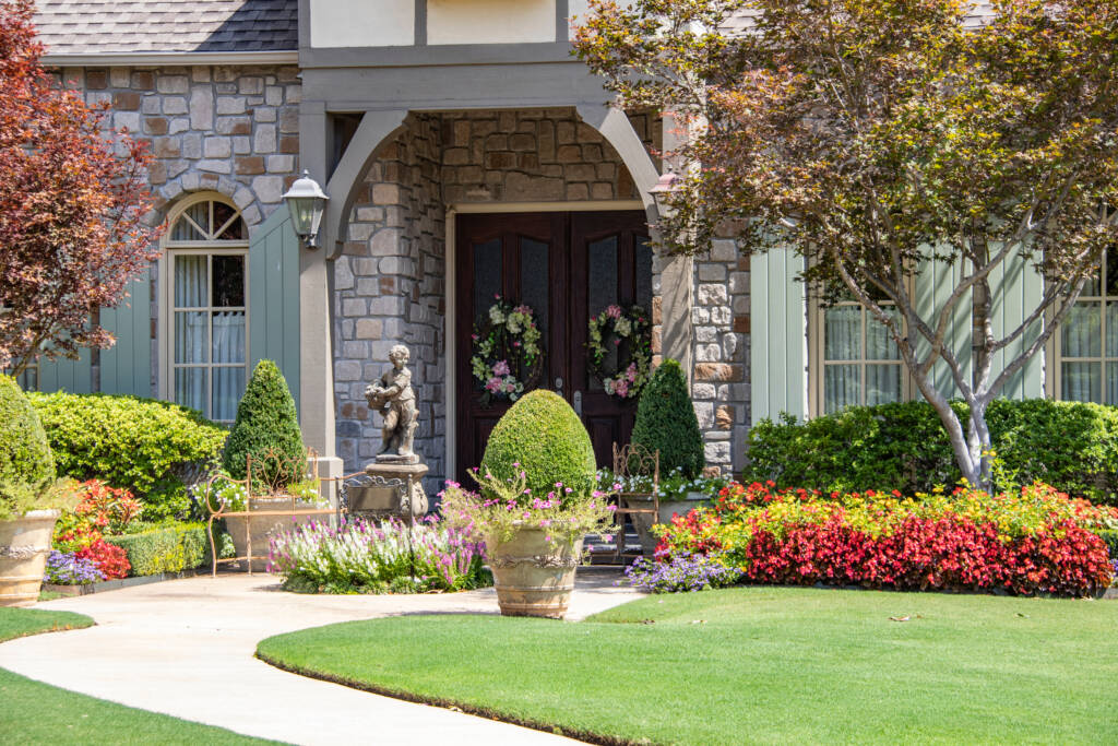 Beautifully landscaped backyard with trees and a well-maintained lawn