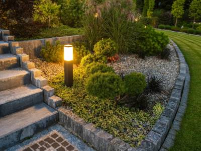 Outdoor seating area surrounded by lush greenery